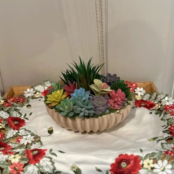 Vibrant succulents on floral tablecloth