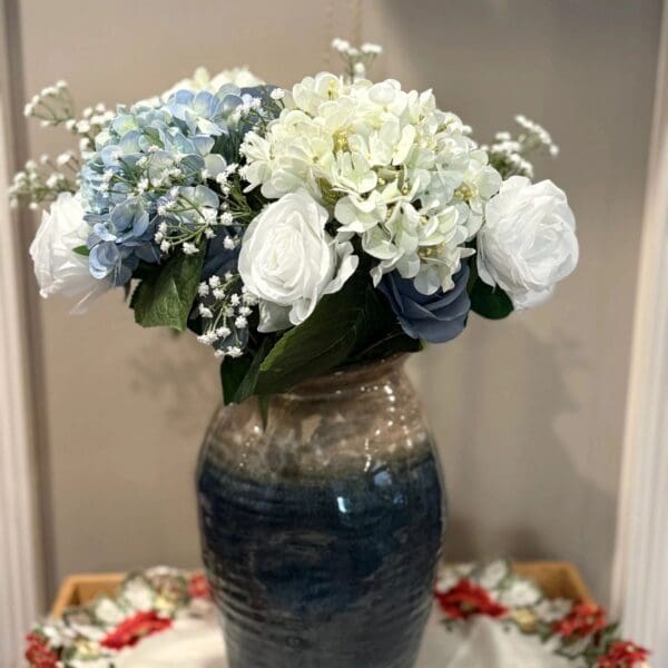 Mixed bouquet in a tall vase
