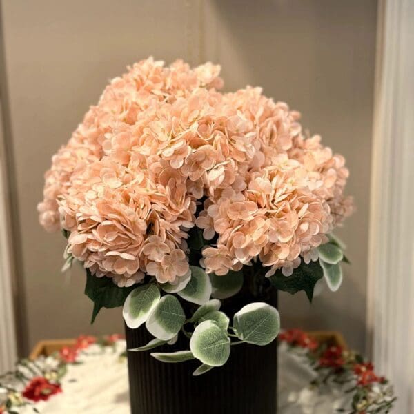 Soft pink flowers with green leaves