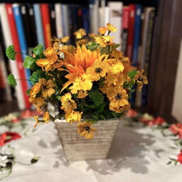 Decorative flowers against a bookshelf backdrop