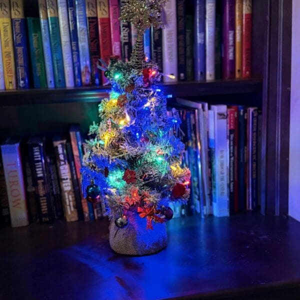 Festive miniature tree on wooden table