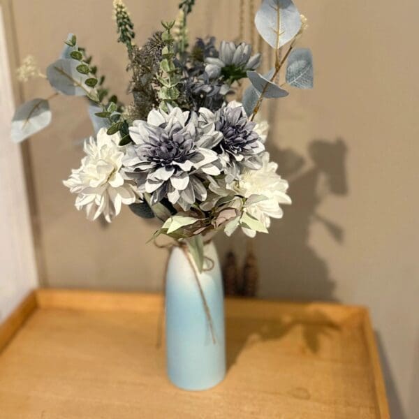 White and blue flowers in a vase