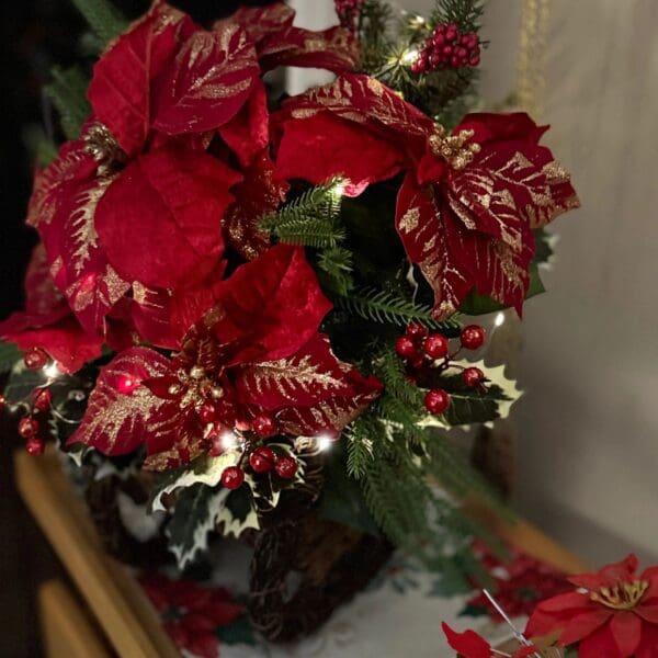 Festive poinsettia and holly centerpiece