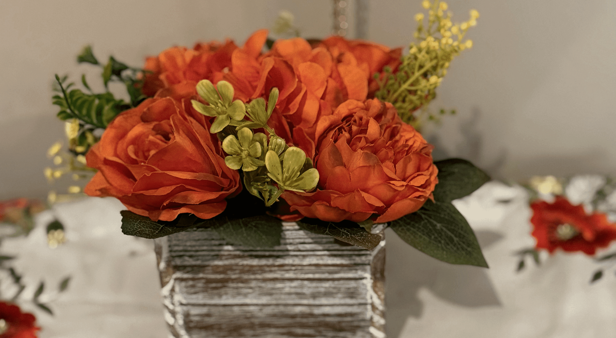 Vibrant orange bouquet with greenery
