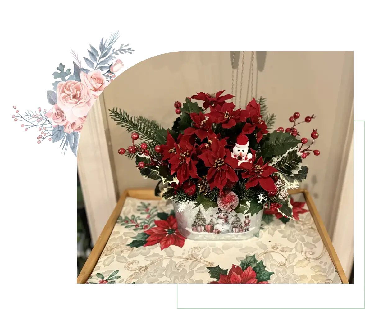 Holiday arrangement with red flowers