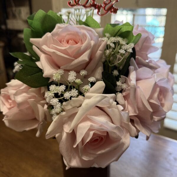 Pink roses bouquet with "PS I Love" topper.