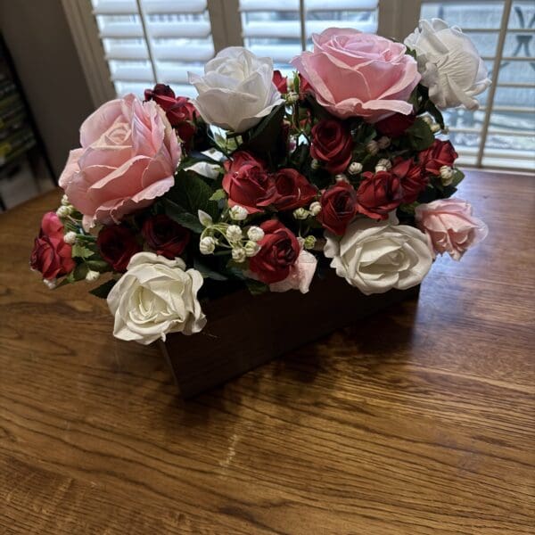 Bouquet of red, pink, and white roses.