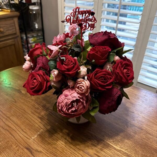 Valentine's Day rose bouquet on table.