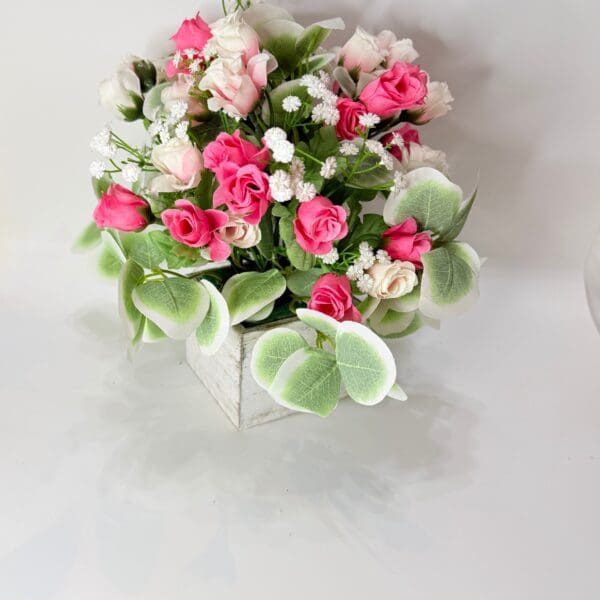 Pink and white flowers in a vase.