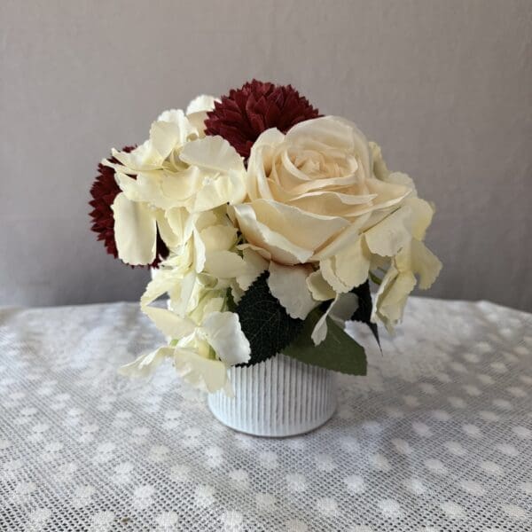 Cream rose bouquet in white vase