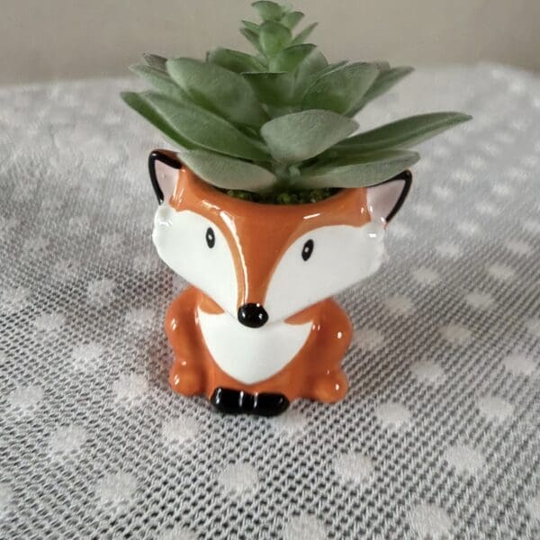 Ceramic fox planter with green succulent