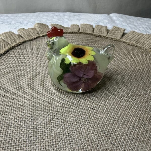 RESIN CHICKEN W/FLOWERS